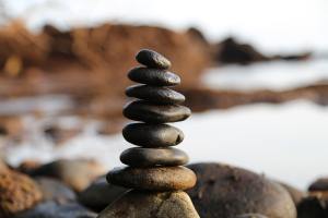 Image of a pile of rocks near a lake.